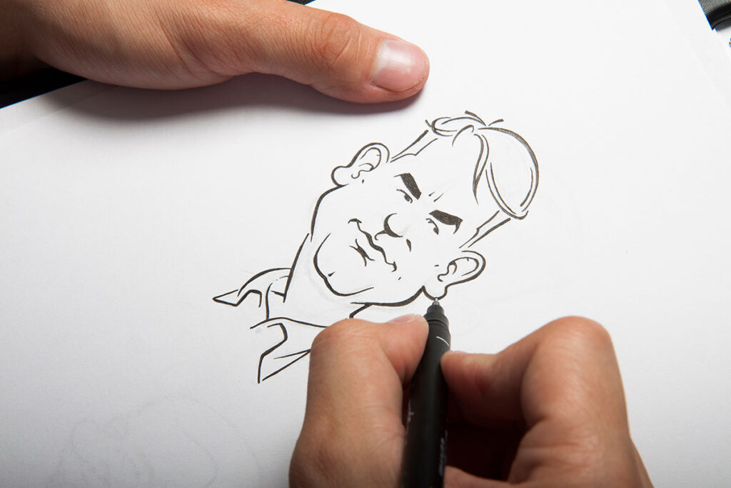 man sketching caricature